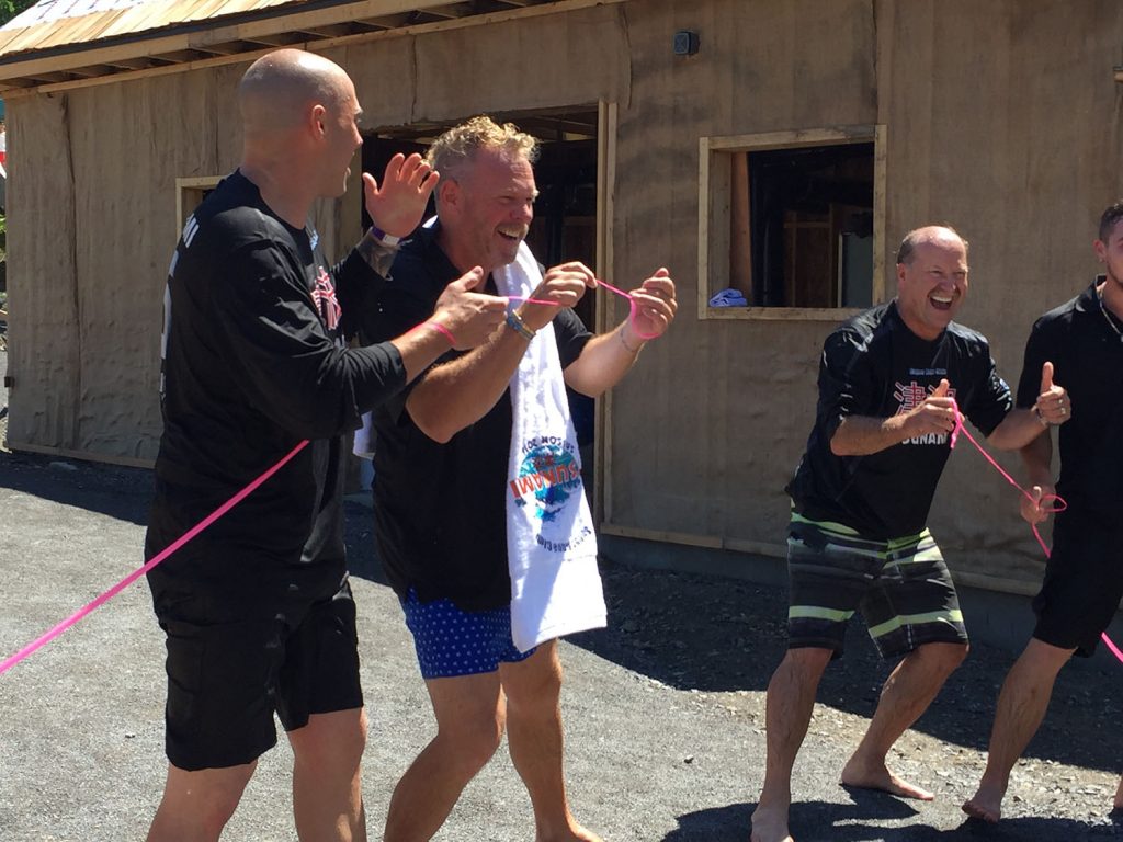 Ribbon Cutting at the Launch of TSUNAMI at Super Aqua Club Point Calumet Left to Right: Étienne Boulay: Former footballer now Dad Blogger & Spokesperson Réjean Julien Proulx: Owner - Super Aqua Club Rick Hunter: Founder & President, ProSlide Technology Inc. 